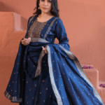 Pair with statement meenakari jhumkas, a sleek bun or braid with gajra, and finish with a golden potli bag and embroidered juttis.