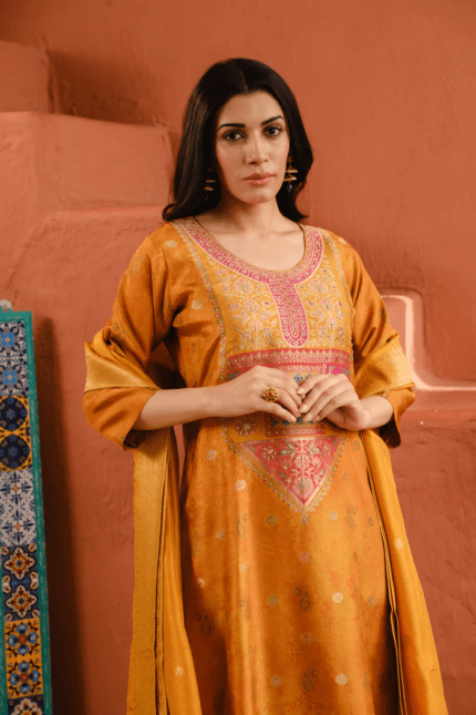 Pair with statement meenakari jhumkas, a sleek bun or braid with gajra, and finish with a golden potli bag and embroidered juttis.